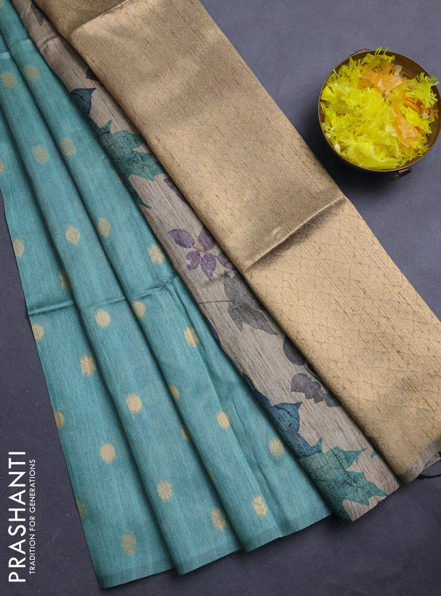 Art dupion saree pastel green and beige with allover zari woven buttas and printed pallu