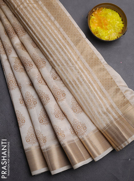 Semi raw silk saree cream with allover butta prints and zari woven border