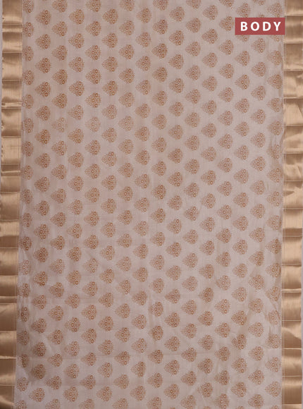 Semi raw silk saree cream with allover butta prints and zari woven border