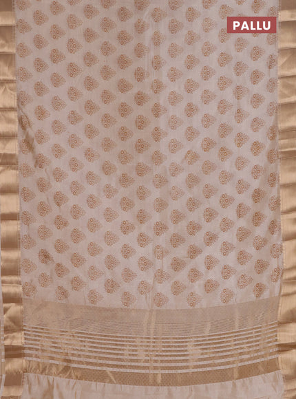 Semi raw silk saree cream with allover butta prints and zari woven border