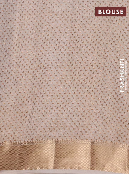 Semi raw silk saree cream with allover butta prints and zari woven border