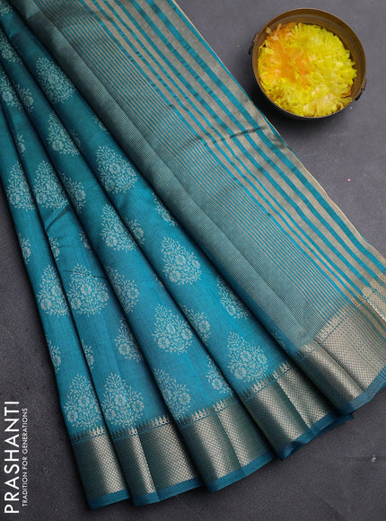 Semi raw silk saree cs blue with allover butta prints and zari woven border