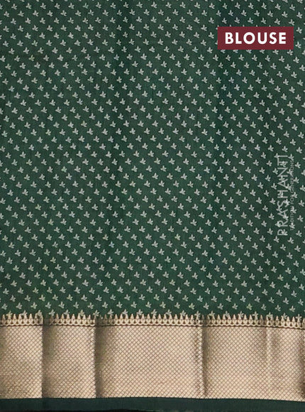 Semi raw silk saree bottle green with allover butta prints and zari woven border