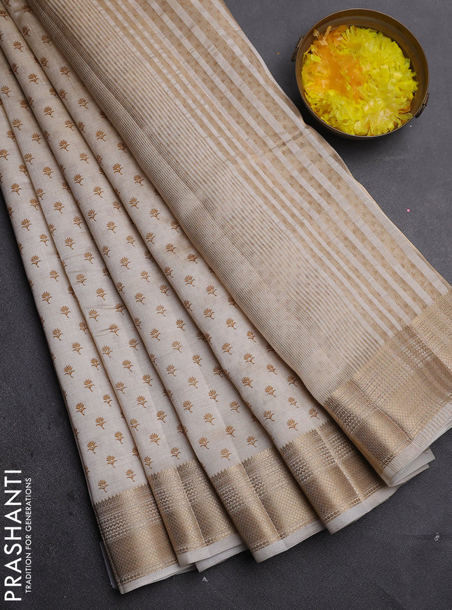 Semi raw silk saree cream with allover butta prints and zari woven border
