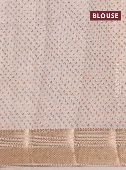 Semi raw silk saree cream with allover butta prints and zari woven border