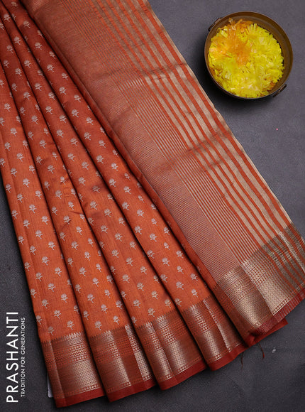 Semi raw silk saree rust shade with allover butta prints and zari woven border