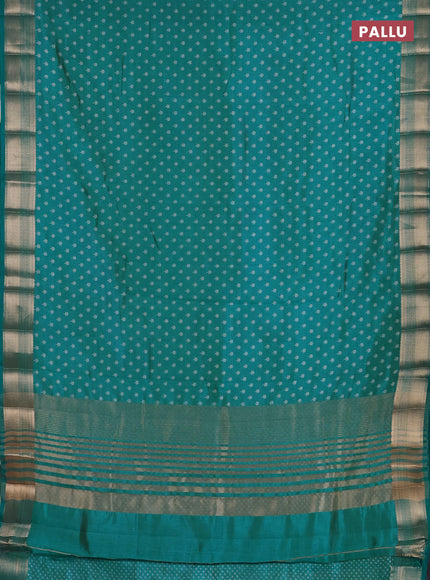 Semi raw silk saree teal blue with allover butta prints and zari woven border