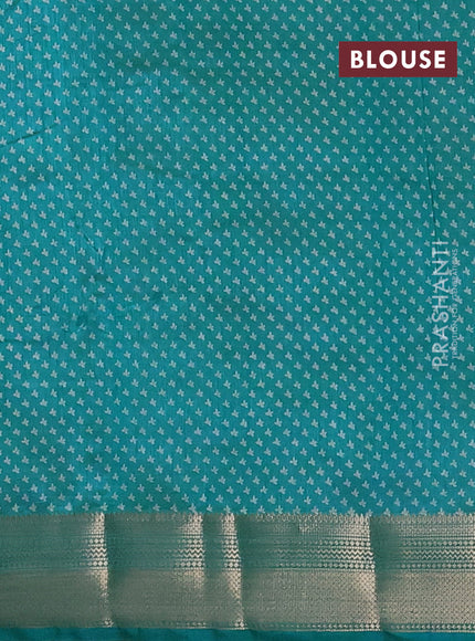 Semi raw silk saree teal blue with allover butta prints and zari woven border