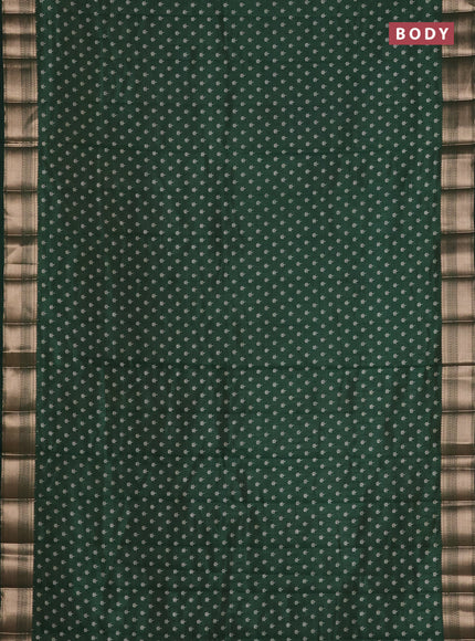 Semi raw silk saree bottle green with allover butta prints and zari woven border