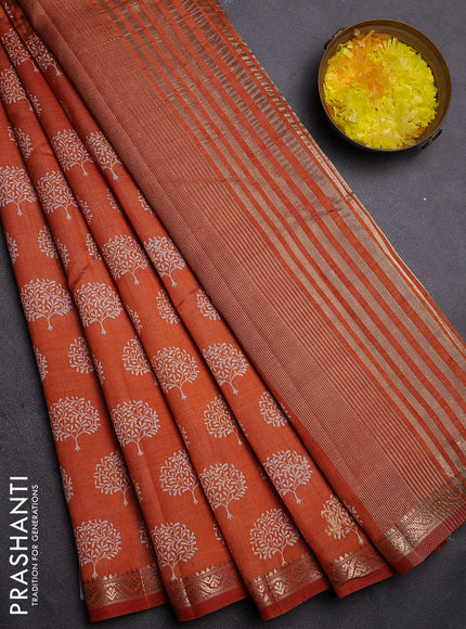 Semi raw silk saree rust shade with allover butta prints and zari woven border