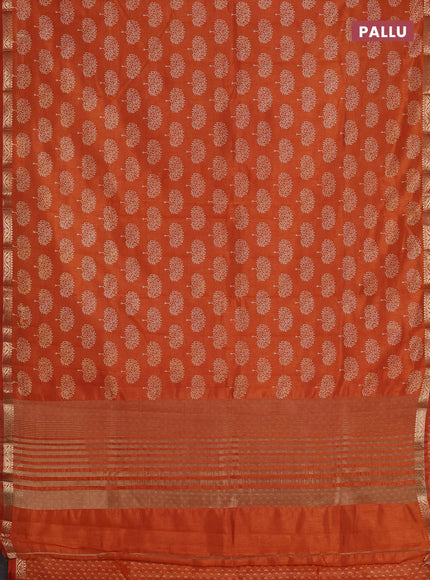 Semi raw silk saree rust shade with allover butta prints and zari woven border