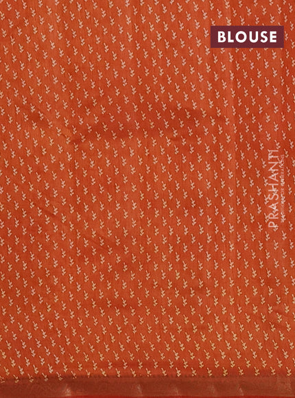 Semi raw silk saree rust shade with allover butta prints and zari woven border