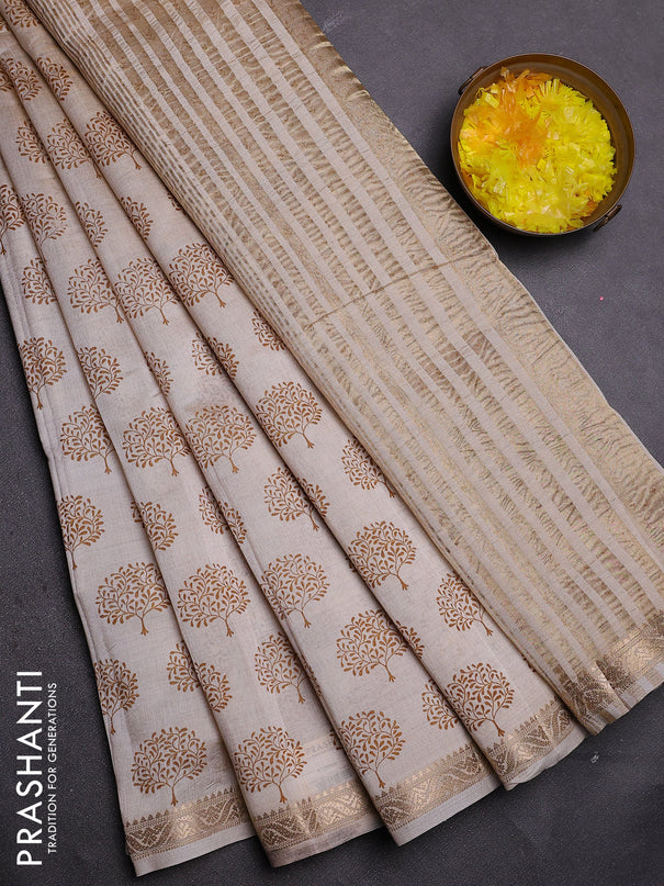 Semi raw silk saree cream with allover butta prints and zari woven border