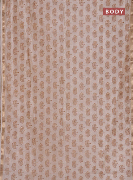Semi raw silk saree cream with allover butta prints and zari woven border