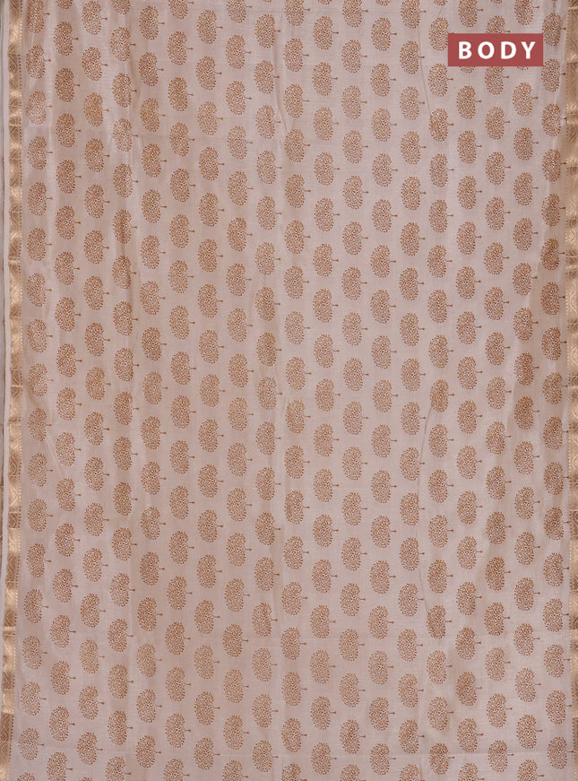 Semi raw silk saree cream with allover butta prints and zari woven border