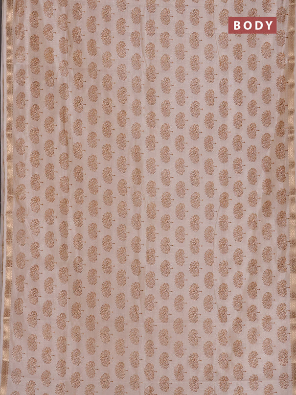 Semi raw silk saree cream with allover butta prints and zari woven border