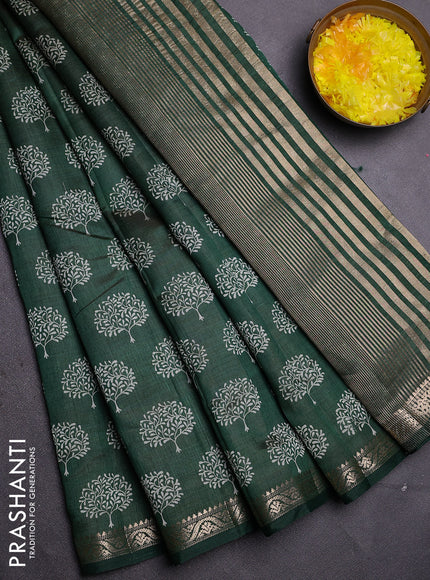 Semi raw silk saree bottle green with allover butta prints and zari woven border