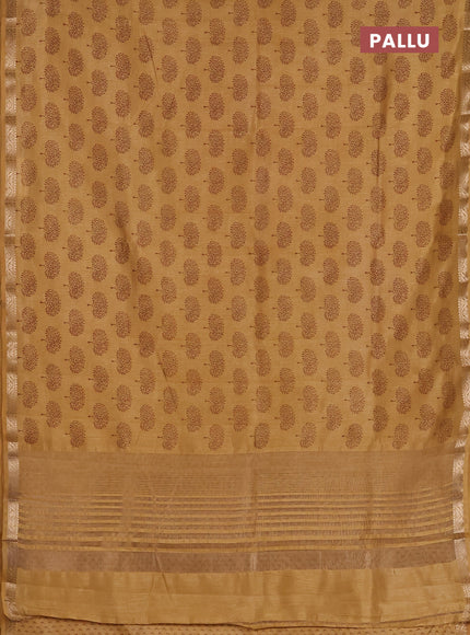 Semi raw silk saree sandal with allover butta prints and zari woven border