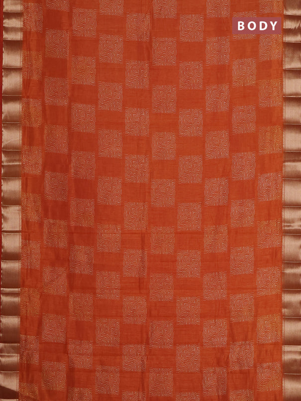 Semi raw silk saree rust shade with allover box type butta prints and zari woven border