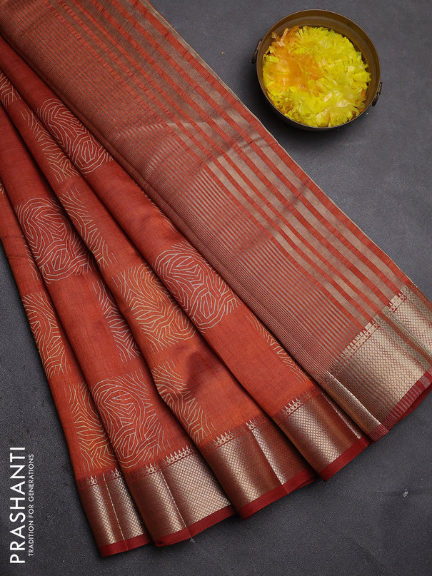 Semi raw silk saree rust shade with allover box type butta prints and zari woven border