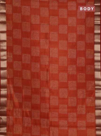 Semi raw silk saree rust shade with allover box type butta prints and zari woven border