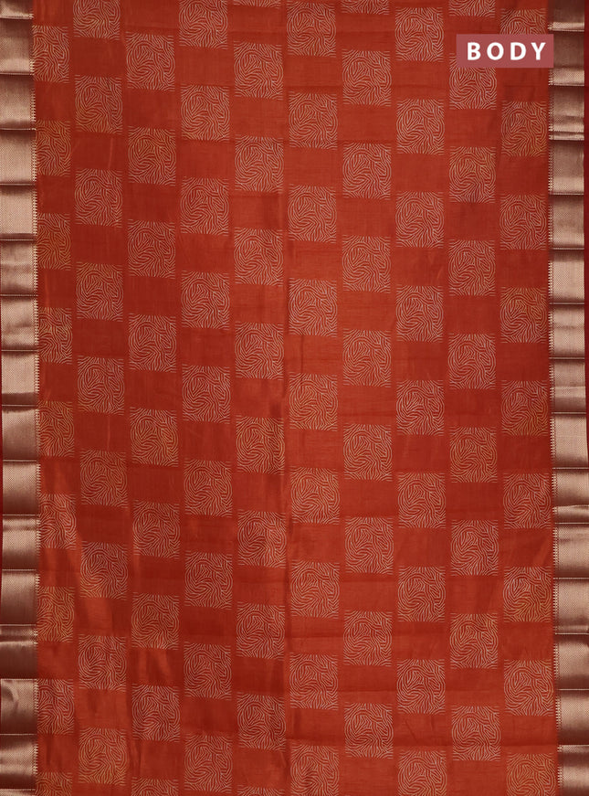 Semi raw silk saree rust shade with allover box type butta prints and zari woven border