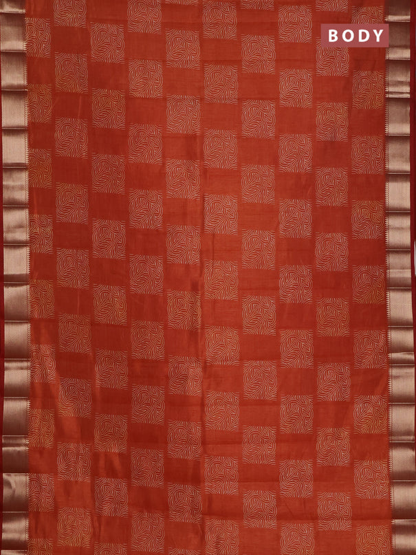 Semi raw silk saree rust shade with allover box type butta prints and zari woven border