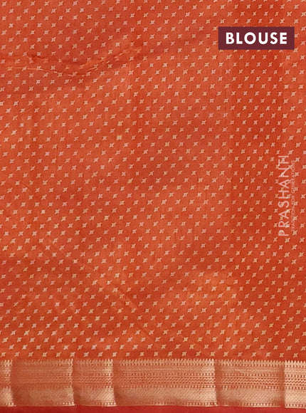 Semi raw silk saree rust shade with allover geometric prints and zari woven border
