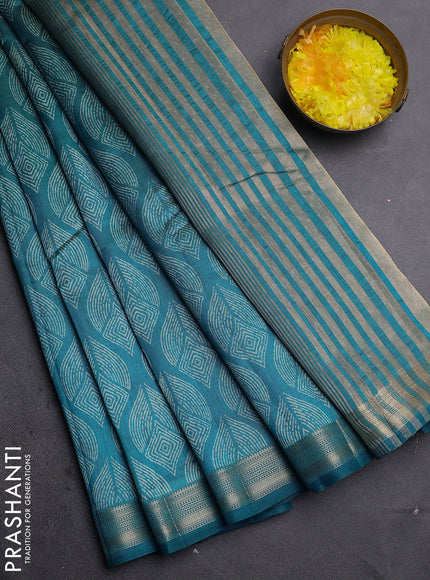 Semi raw silk saree teal blue with allover geometric prints and zari woven border
