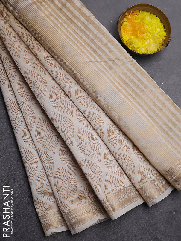 Semi raw silk saree cream with allover geometric prints and zari woven border