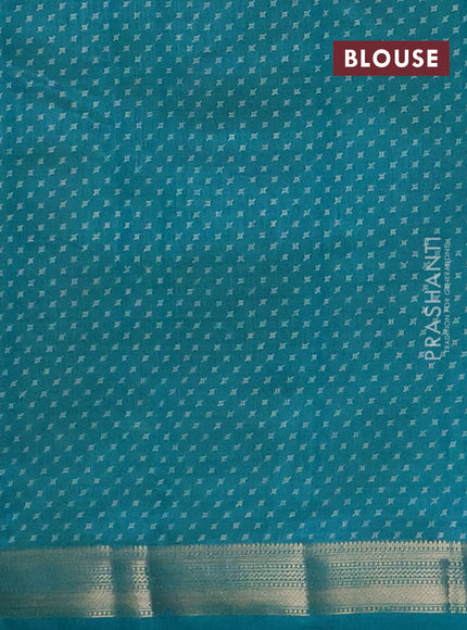 Semi raw silk saree teal green with allover geometric prints and zari woven border