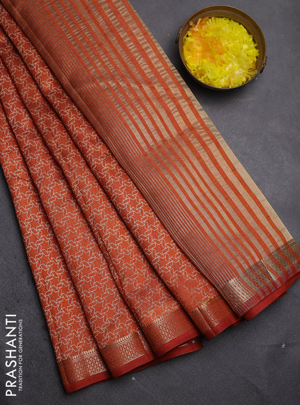 Semi raw silk saree rust shade with allover geometric prints and zari woven border