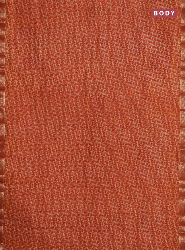 Semi raw silk saree rust shade with allover geometric prints and zari woven border