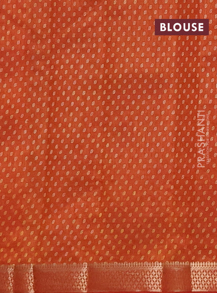 Semi raw silk saree rust shade with allover geometric prints and zari woven border