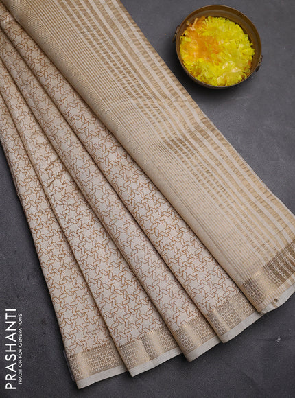 Semi raw silk saree cream with allover geometric prints and zari woven border