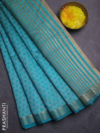 Semi raw silk saree teal blue with allover geometric prints and zari woven border