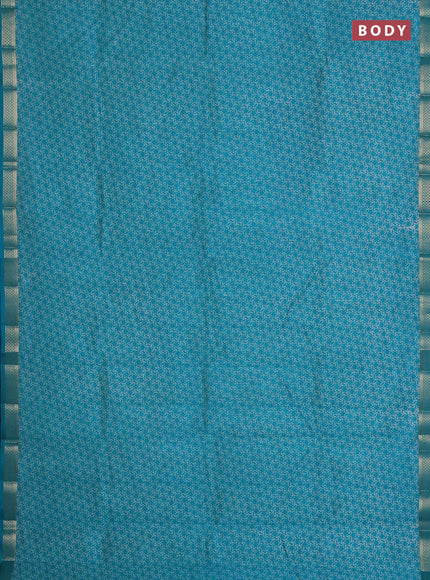 Semi raw silk saree teal blue with allover geometric prints and zari woven border