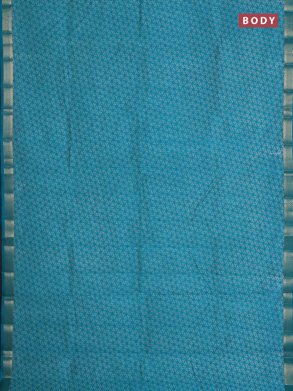 Semi raw silk saree teal blue with allover geometric prints and zari woven border