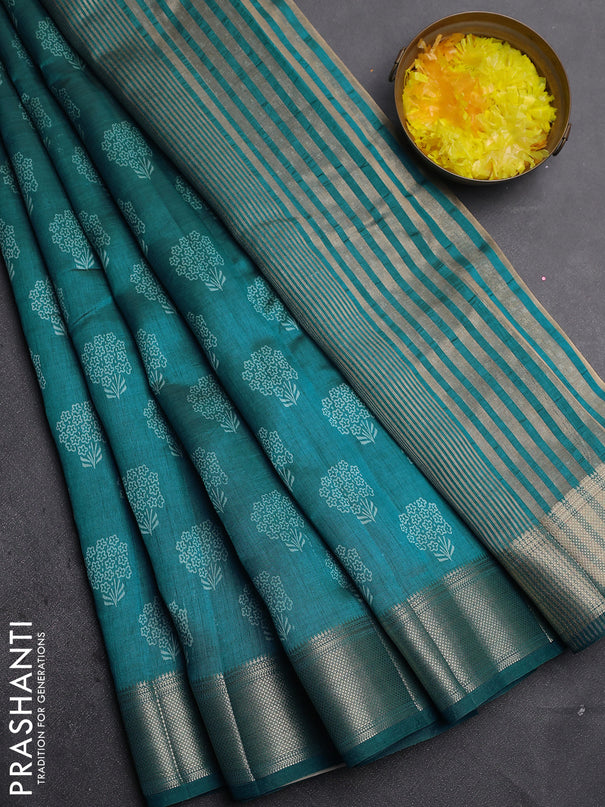 Semi raw silk saree cs blue with allover floral butta prints and zari woven border