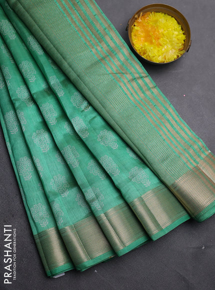 Semi raw silk saree green shade with allover floral butta prints and zari woven border