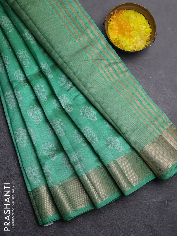 Semi raw silk saree green shade with allover floral butta prints and zari woven border