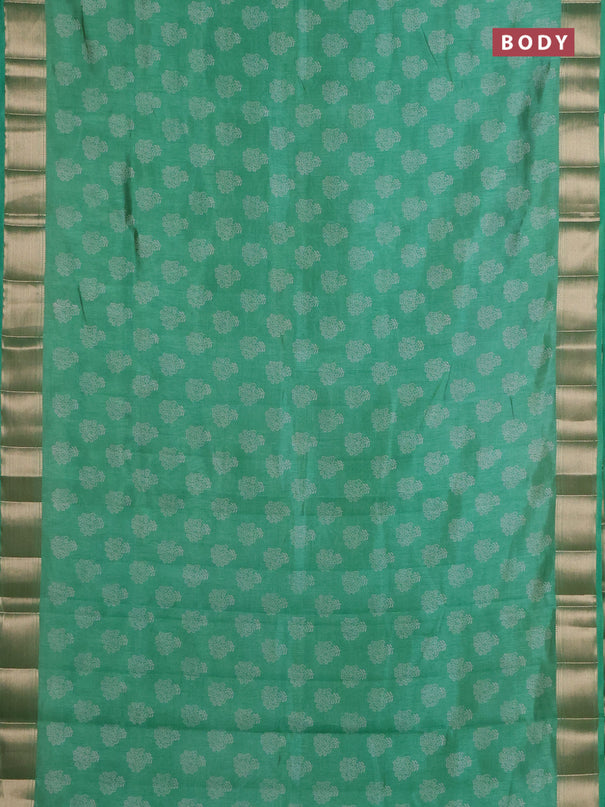 Semi raw silk saree green shade with allover floral butta prints and zari woven border