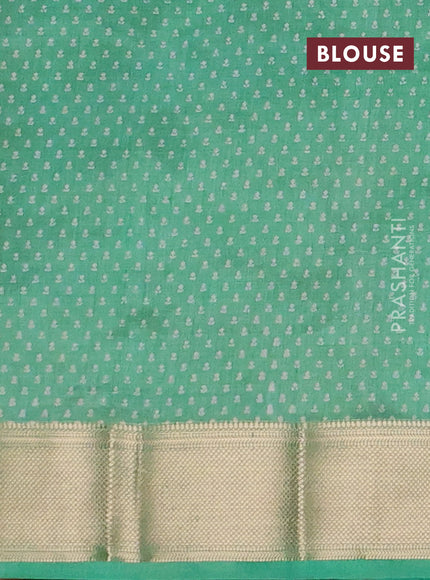 Semi raw silk saree green shade with allover floral butta prints and zari woven border