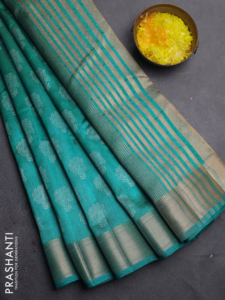 Semi raw silk saree teal blue with allover floral butta prints and zari woven border