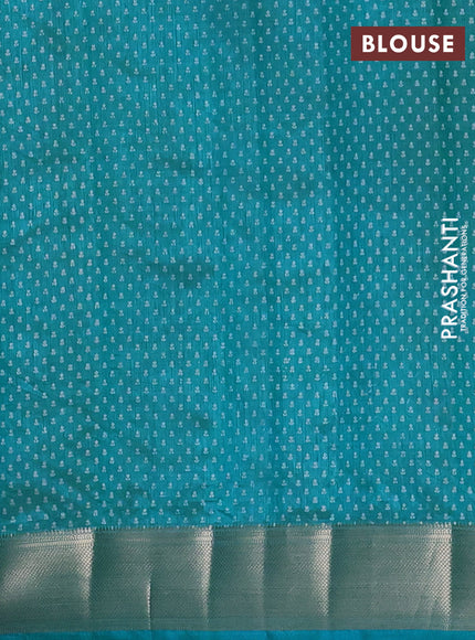 Semi raw silk saree teal blue with allover floral butta prints and zari woven border