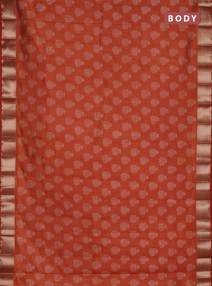 Semi raw silk saree rust shade with allover floral butta prints and zari woven border