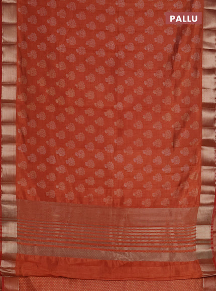 Semi raw silk saree rust shade with allover floral butta prints and zari woven border