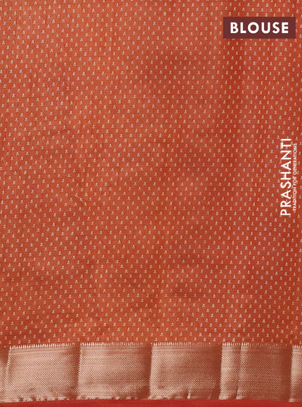 Semi raw silk saree rust shade with allover floral butta prints and zari woven border