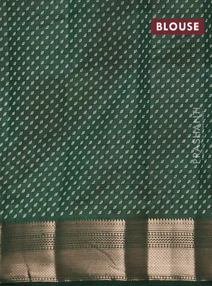 Semi raw silk saree bottle green with allover butta prints and zari woven border