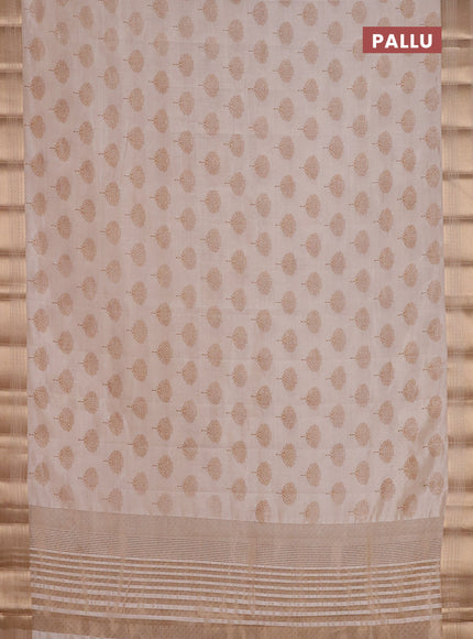 Semi raw silk saree cream with allover butta prints and zari woven border